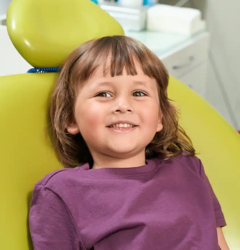 Smiling child preparing for dental treatment