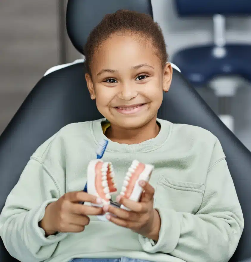 Smiling child receiving sedation dentistry